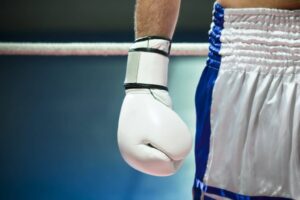 Close up of a boxer with boxing gloves from Motor Medicals