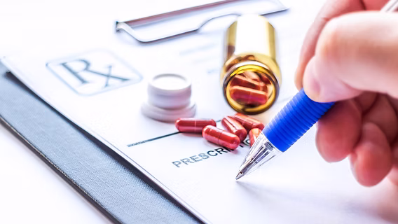 Patient preparing for a safety critical medical assessment at Motor Medicals, reviewing documents and health information with a clinician.