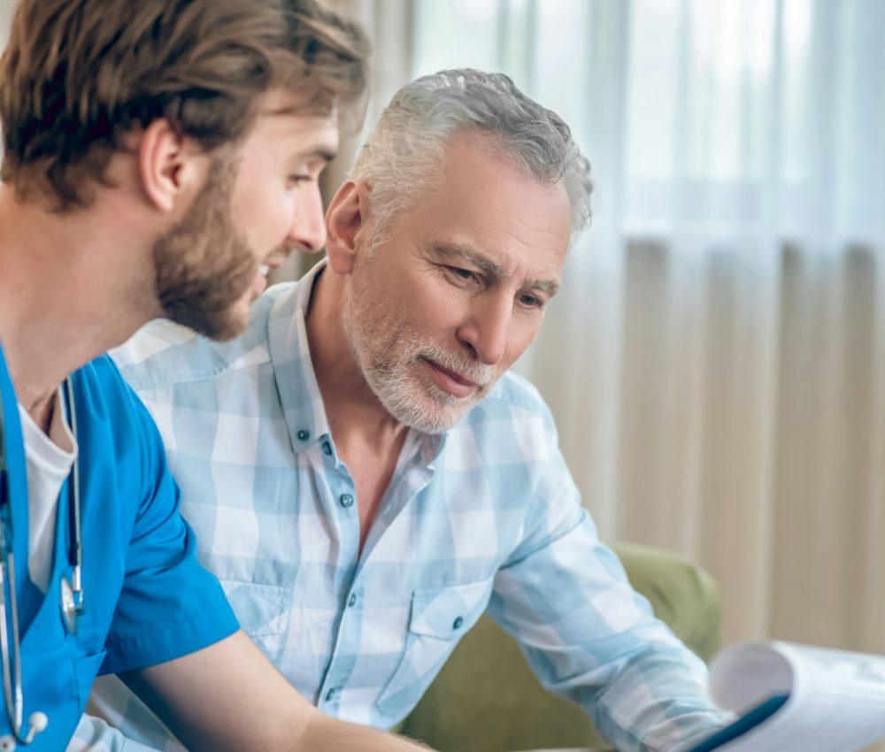 Doctor discussing specialist medicals and fit-to-work evaluations with a patient at MotorMedicals.